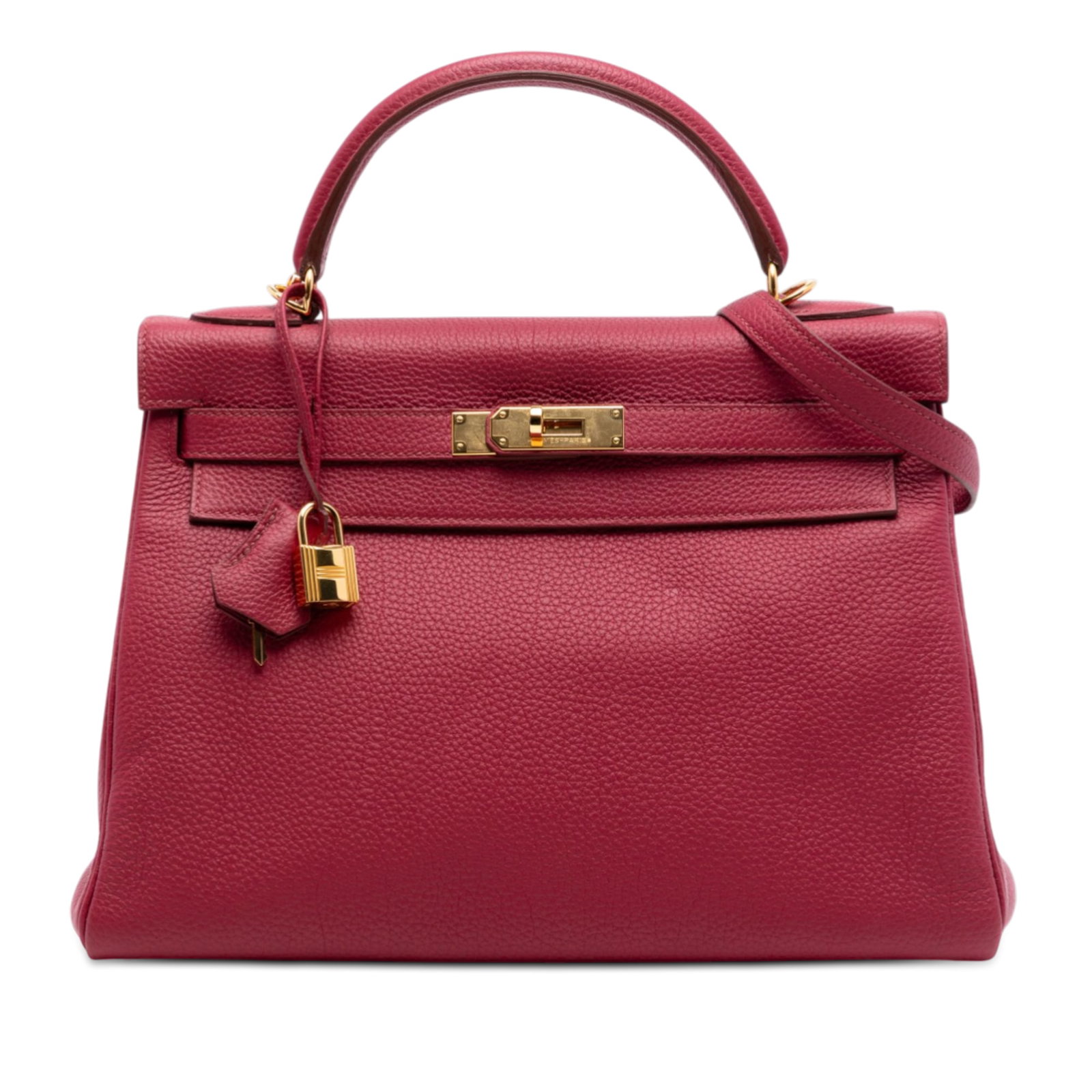 Hermes Kelly II Retourne 32 Rubis Togo Leather Bag: Hermes Kelly II Retourne 32 Rubis Togo Leather Bag The Hermes Togo Kelly II Retourne 32 is crafted from Togo leather in a rich Rubis red color. This bag features a flat leather top handle, a detachabl