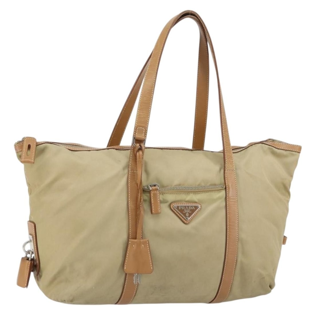 PRADA Beige Silver Nylon Tote Bag with Accessories Made in Italy: PRADA Beige Silver Nylon Tote Bag with Accessories Made in Italy This authentic PRADA Tote Bag is crafted from durable nylon in a stylish beige and silver color combination. Designed for both function