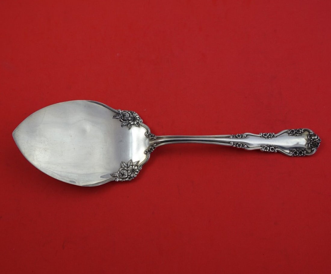 International Sterling Silver Wild Rose Old Pie Server 9 5/8": International Sterling Silver Wild Rose Old Pie Server 9 5/8" This exquisite pie server features the Wild Rose Old pattern, also known as Rosalind Old, crafted by International Sterling. Made from hig