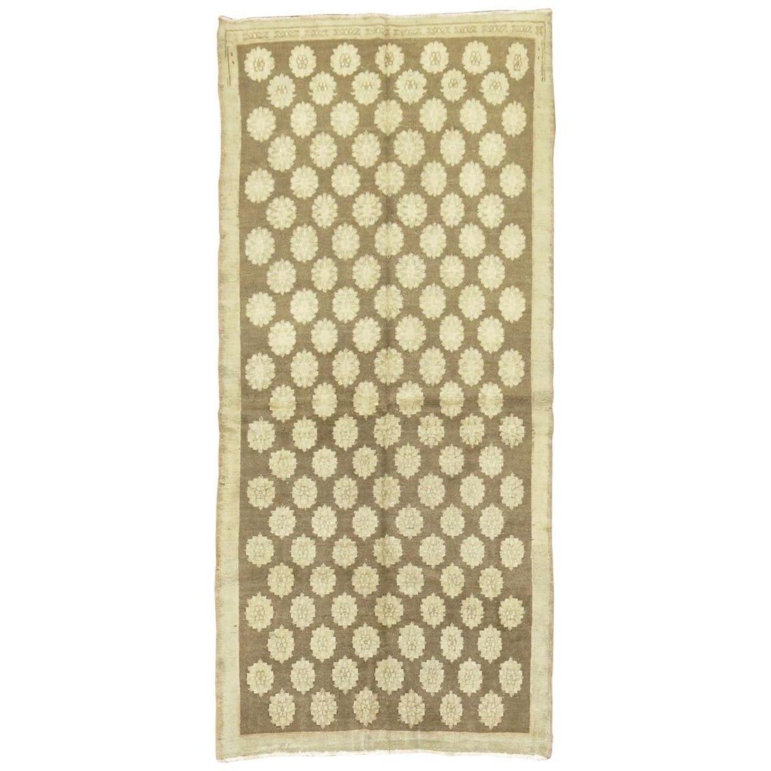 Mid Century Wool Turkish Konya Rug 48 x 101 in: Mid Century Wool Turkish Konya Rug 48 x 101 in This vintage Turkish Konya rug from the mid-20th century features repetitive circular motifs on a brown background. Crafted from wool, it reflects the Mi