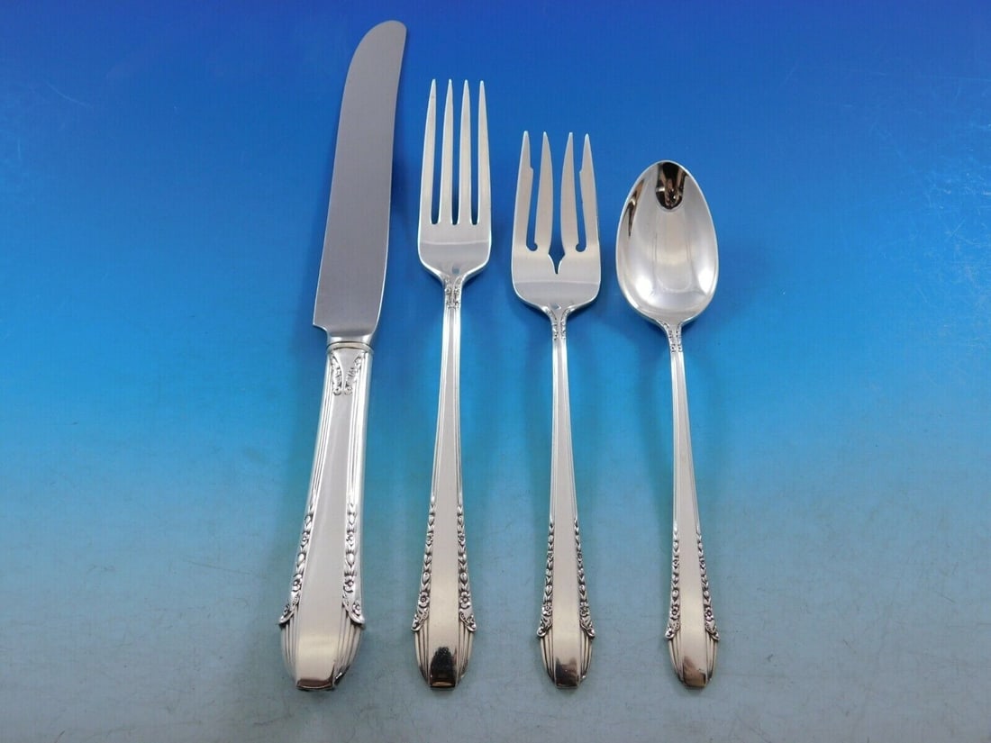 International Sterling Silver Enchantress 4-Piece Place Setting: International Sterling Silver Enchantress 4-Piece Place Setting Discover the elegance of the Enchantress pattern by International Sterling with this exquisite 4-piece place setting. Crafted from high-
