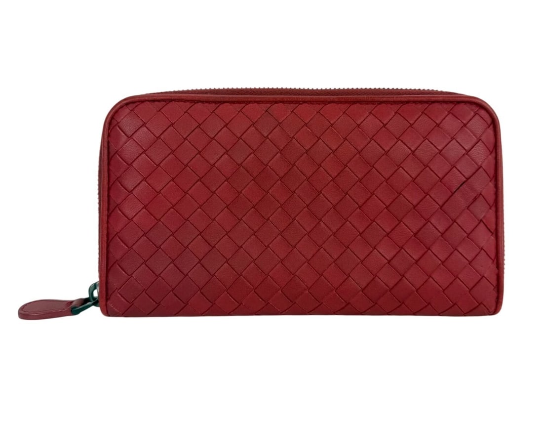 Bottega Veneta Leather Zip Around Wallet Clutch Dark Red: Bottega Veneta Leather Zip Around Wallet Clutch Dark Red This Bottega Veneta Intrecciato zip-around wallet clutch features a solid dark red leather exterior with embroidered accents. Designed in a sma