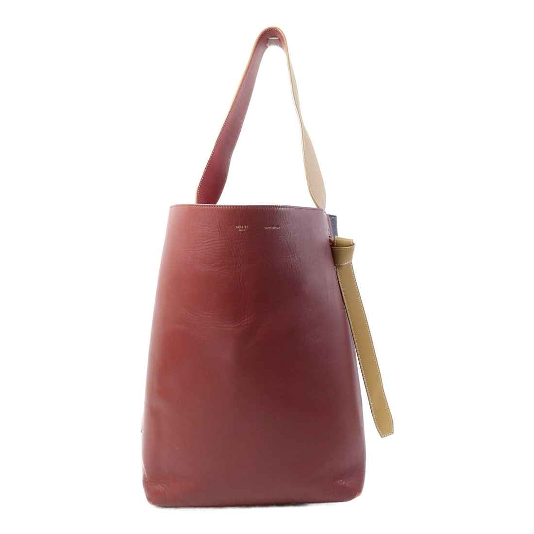 CELINE Twisted Cabas Burgundy Navy Calfskin Shoulder Bag GHW: CELINE Twisted Cabas Burgundy Navy Calfskin Shoulder Bag GHW This Celine Twisted Cabas shoulder bag features a sophisticated design in burgundy and navy calfskin leather. The bag is crafted for women 