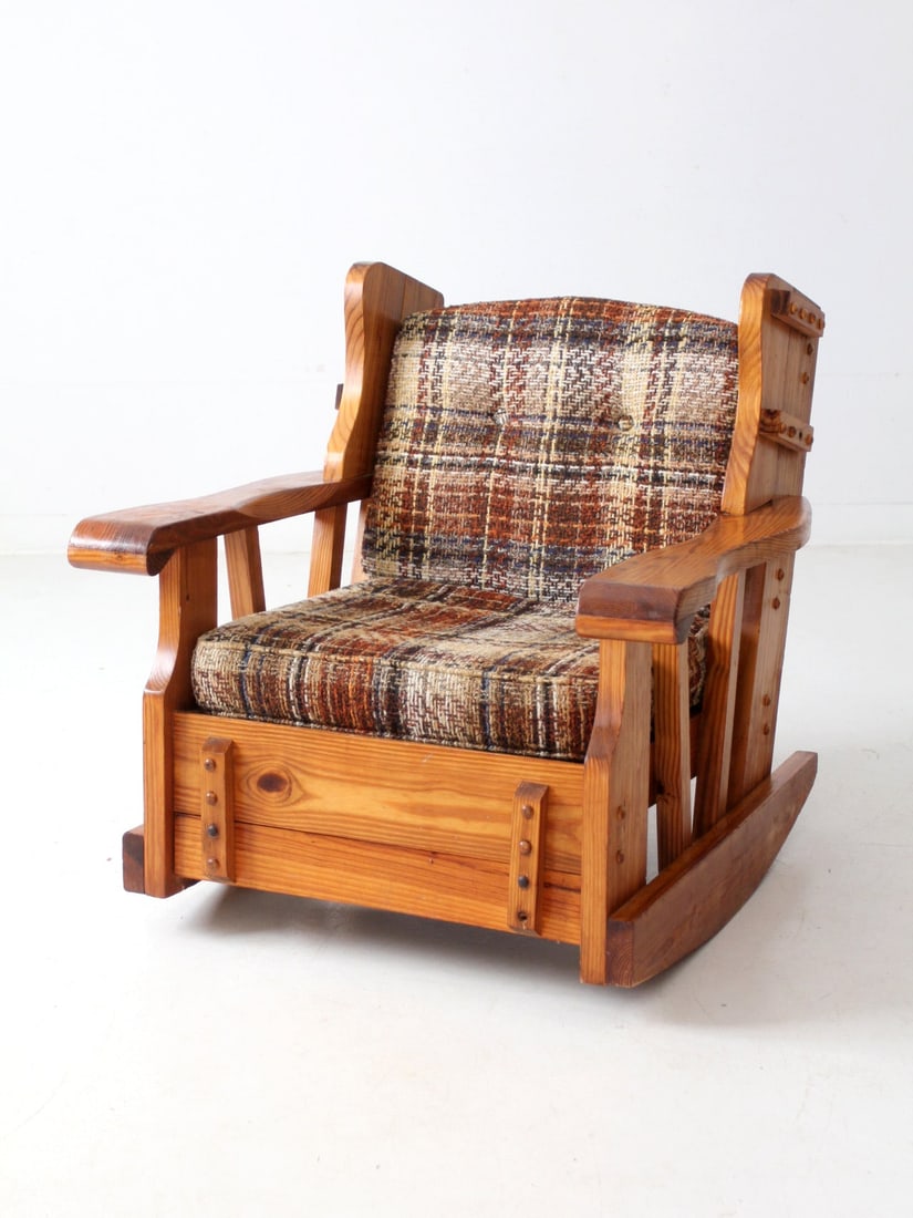 Handcrafted Vintage Pine Rocking Chair with Plaid Cushions: Handcrafted Vintage Pine Rocking Chair with Plaid Cushions This vintage pine rocking chair combines a charming, handcrafted aesthetic with functional design. Its solid pine frame showcases exposed riv