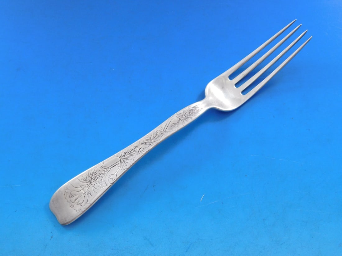 Tiffany & Co Sterling Silver Lap Over Edge Fork 7 1/4 Inch: Tiffany & Co Sterling Silver Lap Over Edge Fork 7 1/4 Inch This exquisite sterling silver regular fork, crafted by Tiffany & Co., features the elegant Lap Over Edge pattern with a charming flower moti