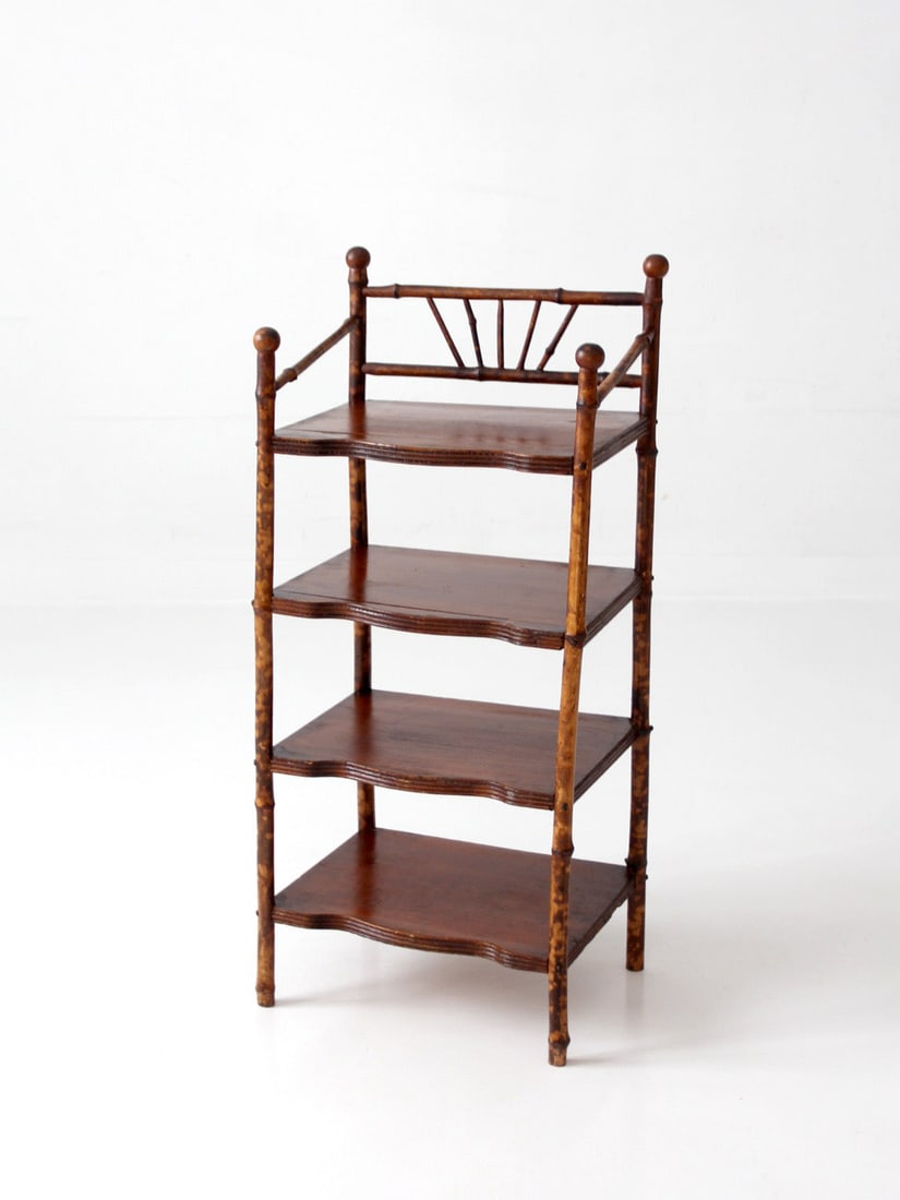 Victorian Bamboo Etagere with Four Shelves: Victorian Bamboo Etagere with Four Shelves This antique bamboo etagere dates from the late 19th to early 20th century and features four graduated shelves supported by turned bamboo forms. The gallery 
