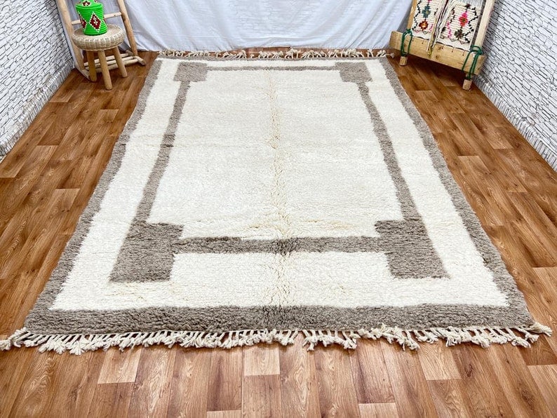 Authentic Handwoven Moroccan Soft Rug 8x5' 100% Wool: Authentic Handwoven Moroccan Soft Rug 8x5' 100% Wool Discover the beauty of this authentic soft rug, handwoven by skilled Berber women in the Atlas Mountains of Morocco. Crafted using traditional tech