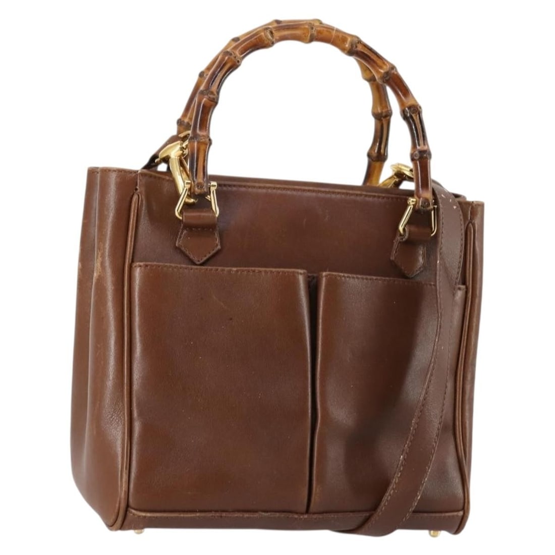 Gucci Bamboo leather handbag with shoulder strap brown gold: Gucci Bamboo leather handbag with shoulder strap brown gold This GUCCI Bamboo Hand Bag is crafted from brown and gold leather and features both a top handle and a detachable shoulder strap for versati