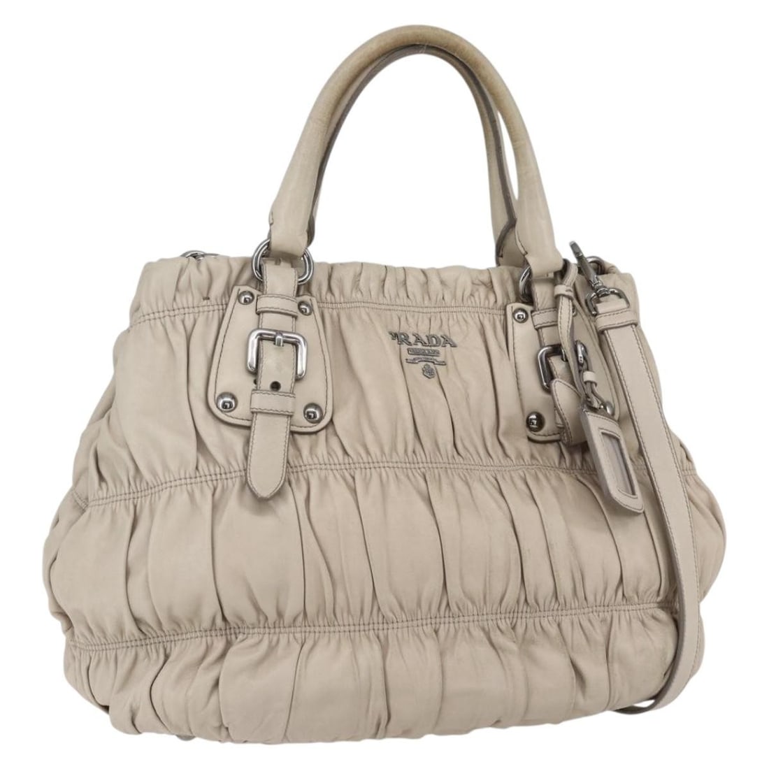 PRADA Gathered Leather 2way Handbag Beige Silver with Strap: PRADA Gathered Leather 2way Handbag Beige Silver with Strap Prada gathered 2-way handbag in beige leather with silver-tone accents. This women's bag includes a name tag and shoulder strap, and can be 