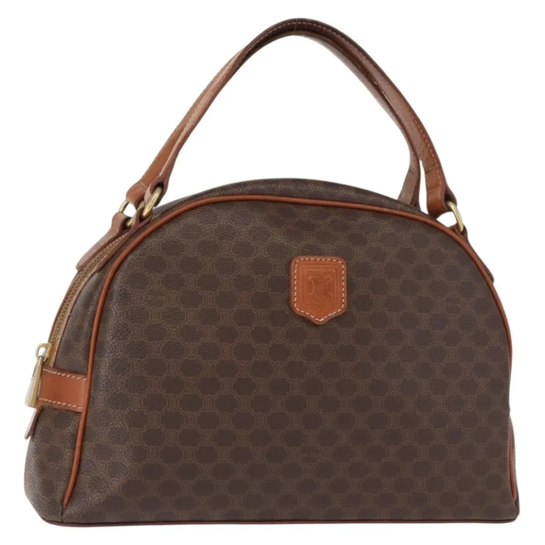 Vintage Macadam Brown Canvas and Leather Handbag by Celine: Vintage Macadam Brown Canvas and Leather Handbag by Celine This pre-owned Celine Vintage Macadam handbag is crafted from brown canvas with leather accents. It features a structured silhouette suitable