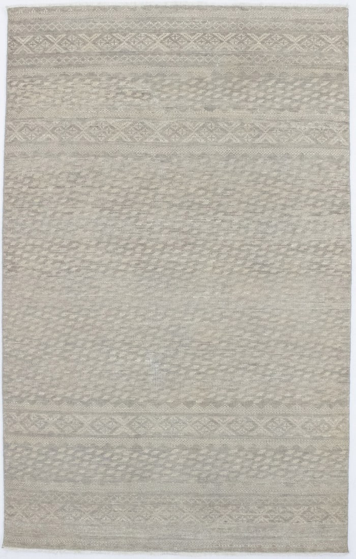 5x8 Wool Hand-Knotted Area Rug in Tribal Vintage Beige Tones: 5x8 Wool Hand-Knotted Area Rug in Tribal Vintage Beige Tones This handmade area rug features a muted beige color palette with tribal and geometric patterns, offering a vintage-inspired look. Expertly 