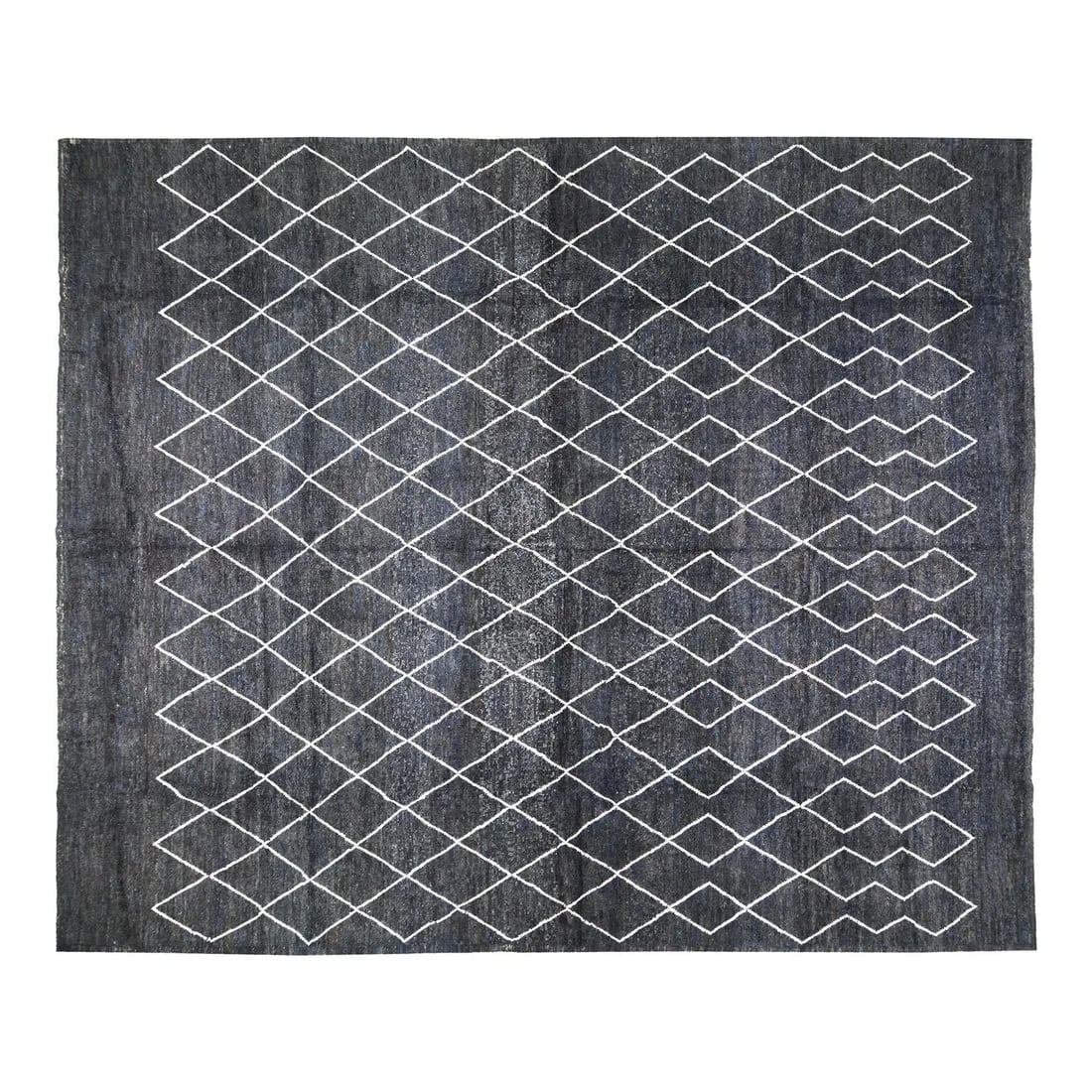 Charcoal Wool Area Rug Handcrafted in Morocco 8'3" x 9'9": Charcoal Wool Area Rug Handcrafted in Morocco 8'3" x 9'9" This Moroccan hand-knotted wool rug showcases traditional craftsmanship combined with contemporary design elements. Its soft, durable wool con