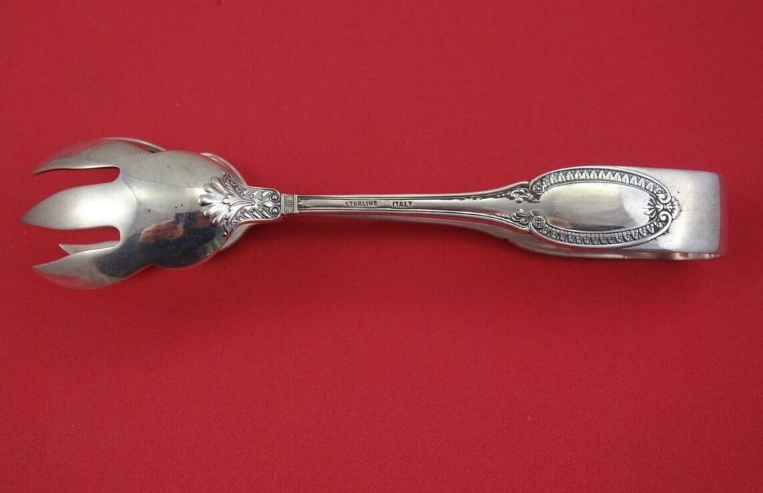 Buccellati Empire Sterling Silver Ice Tong 6 Inches: Buccellati Empire Sterling Silver Ice Tong 6 Inches Discover the elegance of the Empire Ice Tong by Buccellati, crafted from high-quality sterling silver. This beautifully designed piece measures 6 in