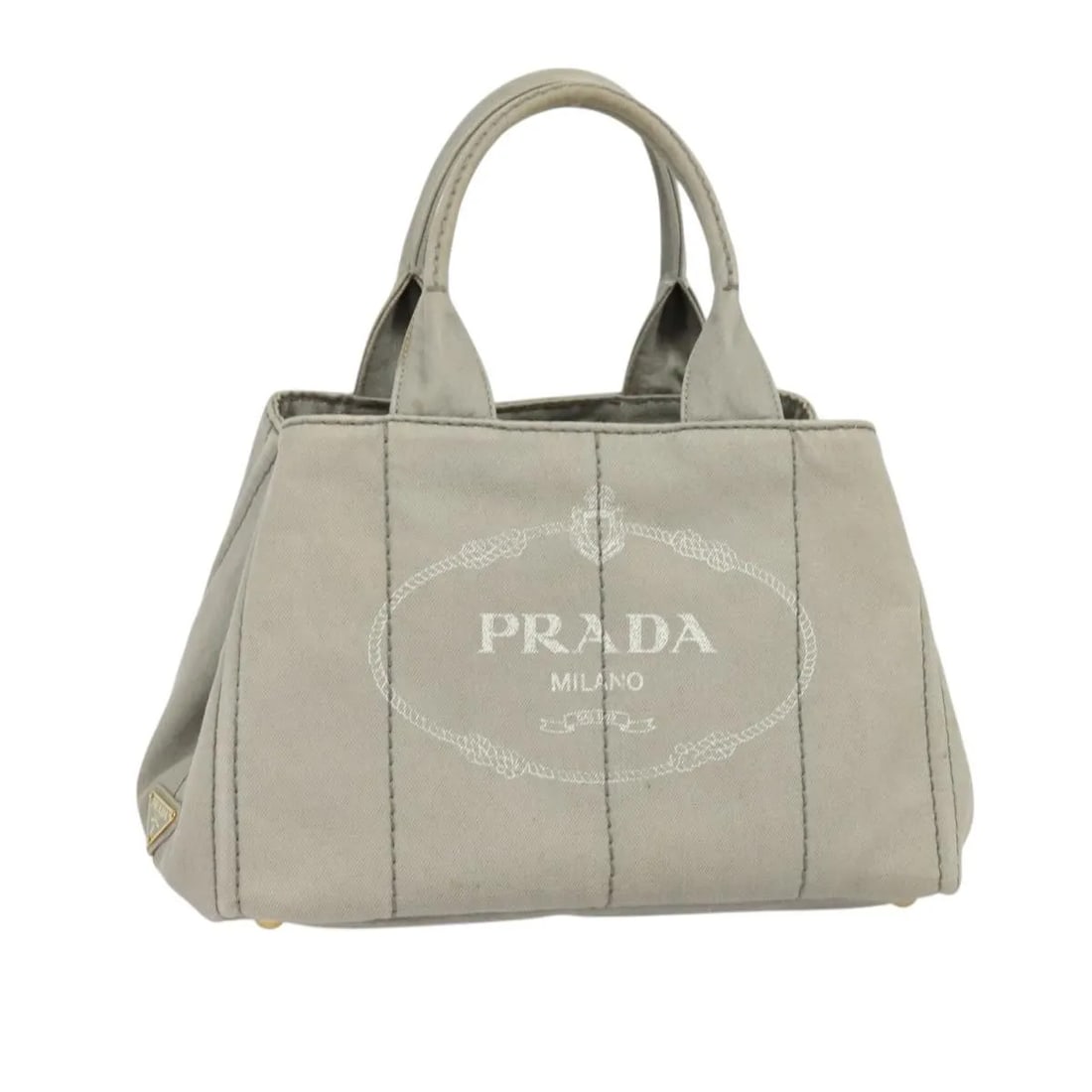 Prada Gray Canvas Canapa Tote Bag 34cm by 22cm by 20.5cm: Prada Gray Canvas Canapa Tote Bag 34cm by 22cm by 20.5cm This Prada Canapa Tote is crafted from gray canvas and designed for women. It features a spacious interior with a pocket and metal fittings. Th