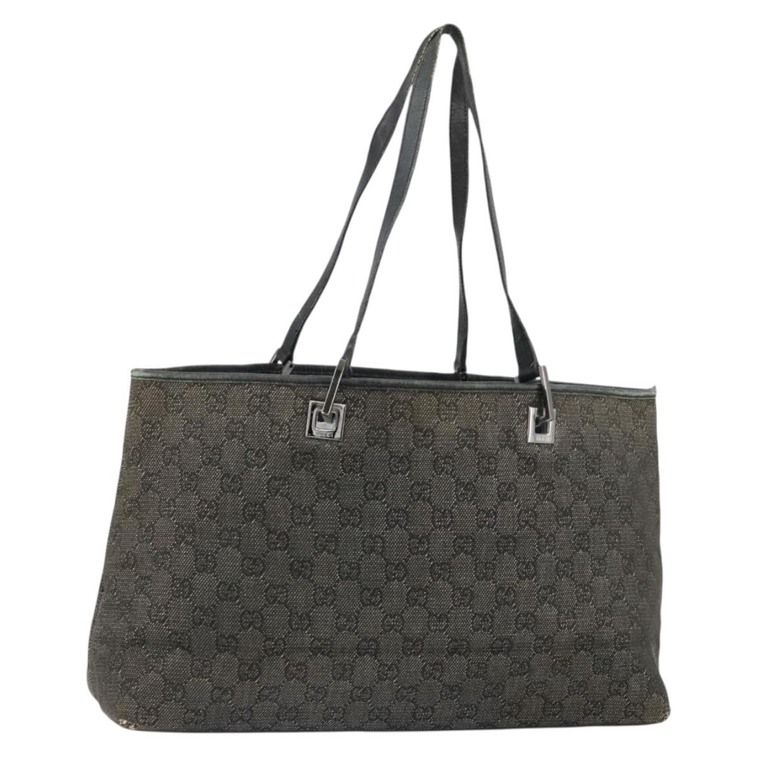GUCCI GG Canvas Tote Bag Black Silver 36173 1705 Authentic: GUCCI GG Canvas Tote Bag Black Silver 36173 1705 Authentic This authentic GUCCI GG Canvas Tote Bag is a stylish and functional accessory, crafted in Italy. The bag features a chic black and silver ext