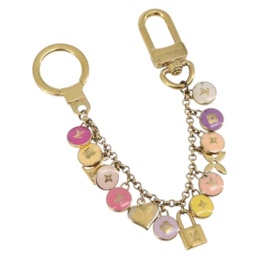 Louis Vuitton M65386 metal key holder in gold tone: Louis Vuitton M65386 metal key holder in gold tone Louis Vuitton Porte Cles Chainne Pastille key holder in gold-tone metal. This women's accessory is made in Italy and features a heavily used conditio