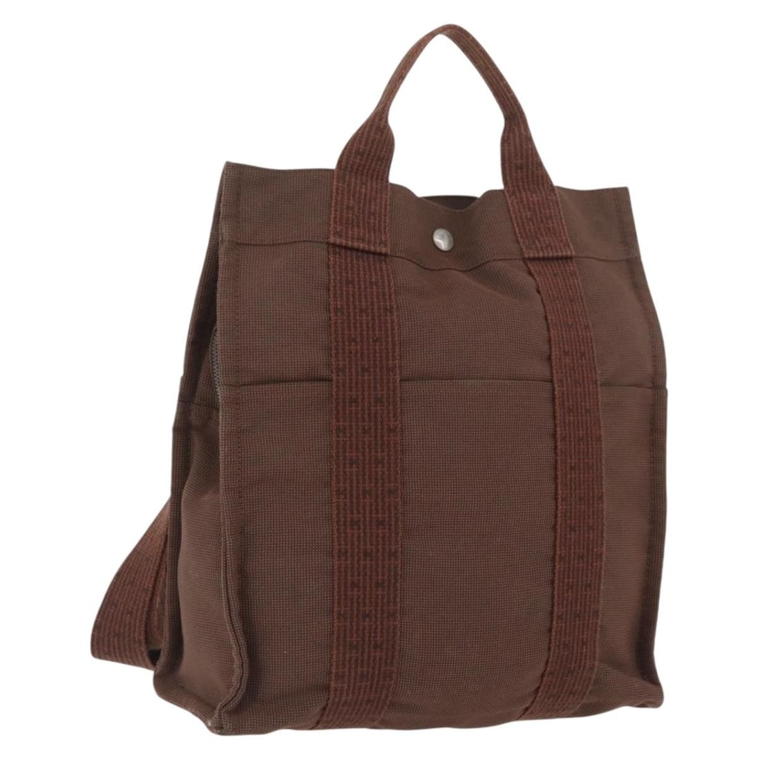 Hermes Her Line Canvas Brown Backpack with Silver Tone Hardware: Hermes Her Line Canvas Brown Backpack with Silver Tone Hardware This Hermes Her Line Sac A Dos backpack is crafted from brown canvas with silver-tone accents. Designed for women, it features a spaciou