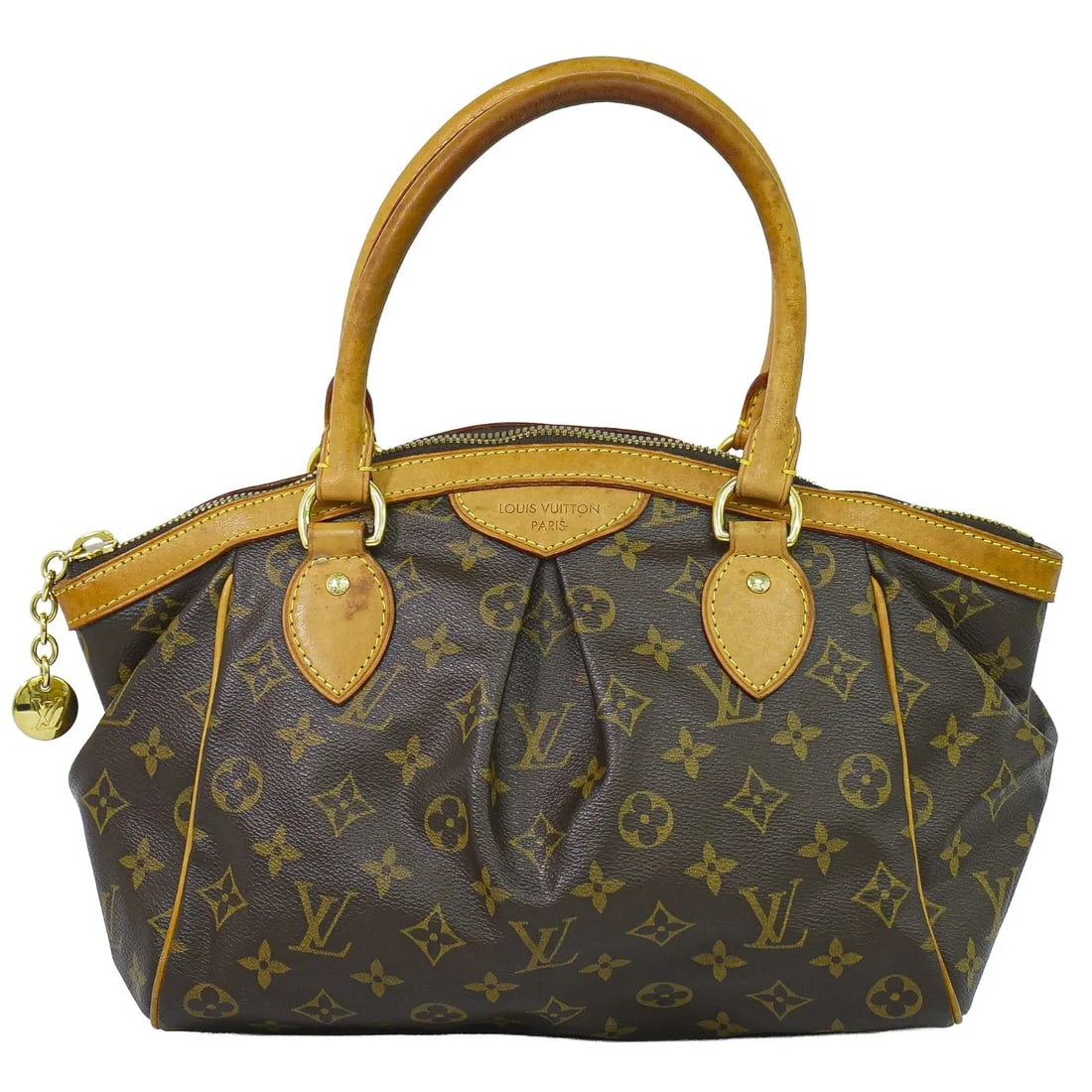 Louis Vuitton Tivoli Brown Monogram Canvas Handbag: Louis Vuitton Tivoli Brown Monogram Canvas Handbag Louis Vuitton Tivoli handbag in brown monogram canvas. This women's bag is in good overall condition with visible signs of use, including wear, stain