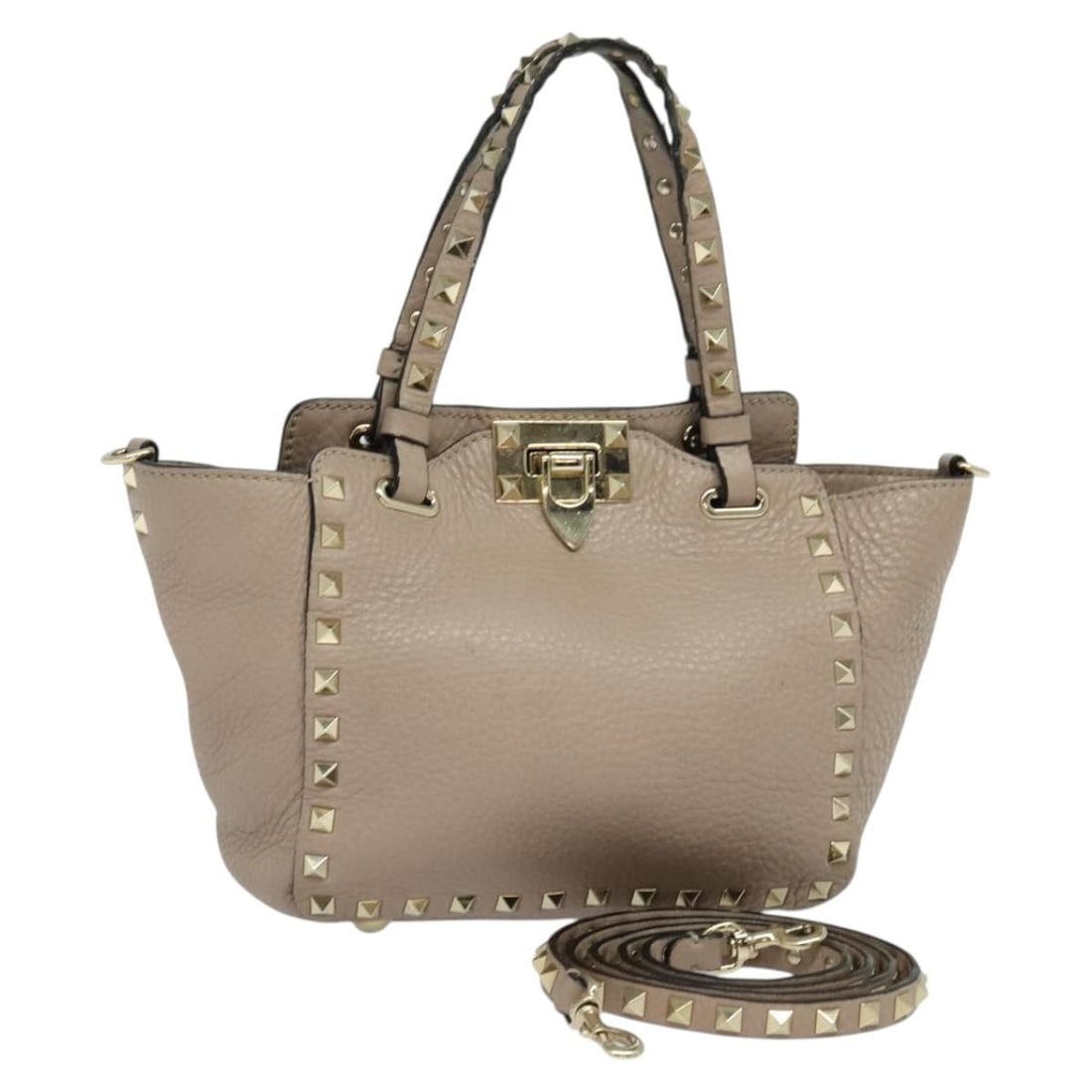 Valentino pink leather studded handbag with shoulder strap: Valentino pink leather studded handbag with shoulder strap This Valentino handbag is crafted from pink leather and features signature stud detailing. Designed as a versatile 2-way bag, it includes bot