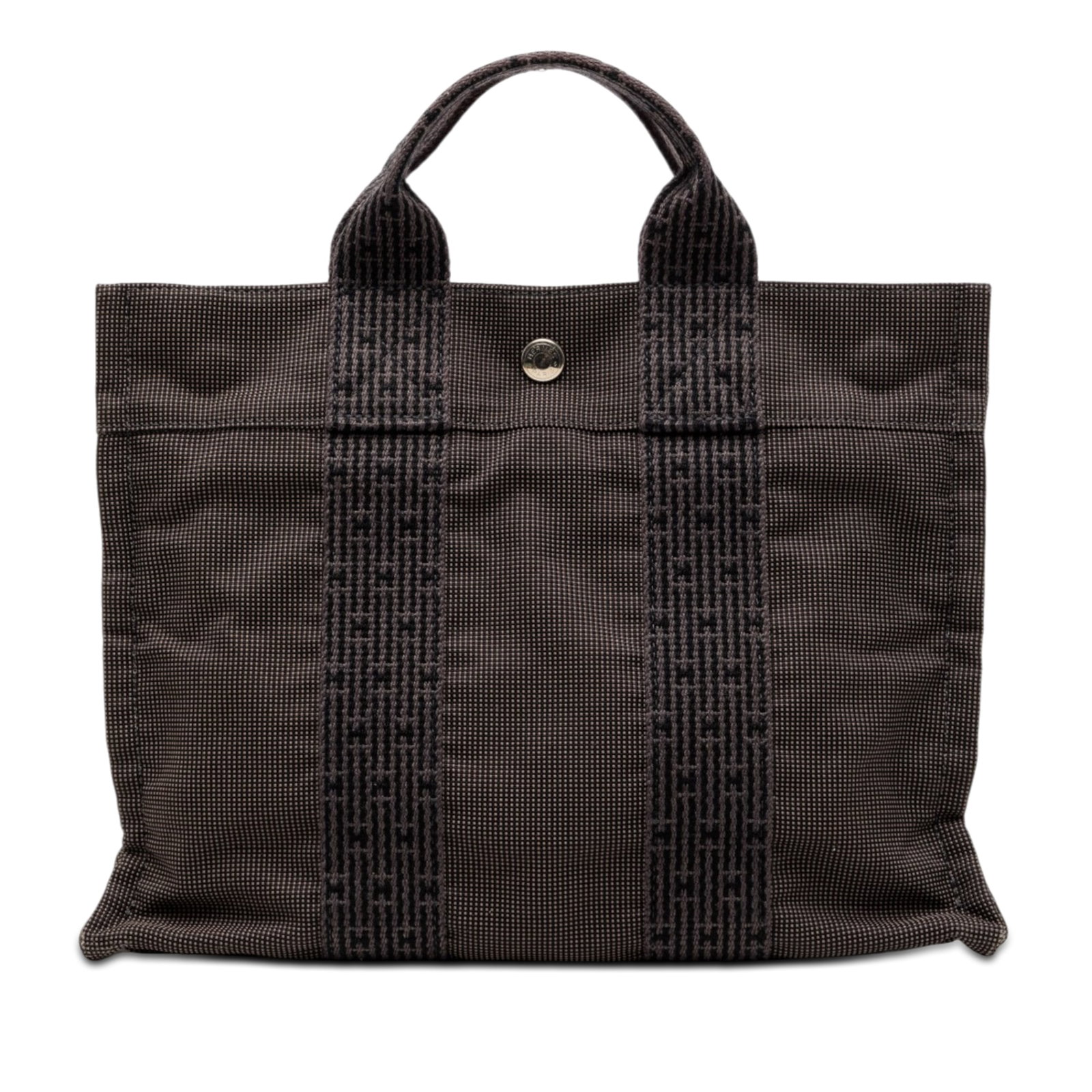 Hermes Herline PM gray canvas tote bag: Hermes Herline PM gray canvas tote bag The Hermes Canvas Herline PM is a compact bag crafted from durable fabric in a gray color. It features flat straps, an open top with a snap closure, and an inter