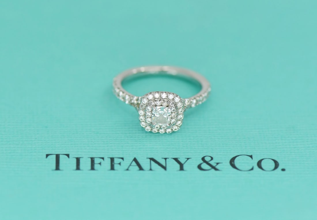 Tiffany & Co Soleste Platinum Cushion Diamond Engagement Ring Size 3: Tiffany & Co Soleste Platinum Cushion Diamond Engagement Ring Size 3 This pre-owned Tiffany & Co. Soleste engagement ring features a cushion-cut diamond center stone with a total carat weight of 0.49.