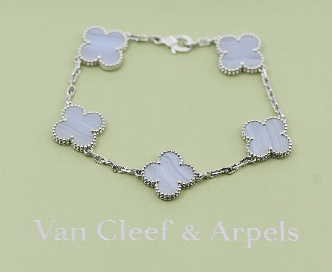 Van Cleef Arpels Vintage Alhambra Chalcedony 18K White Gold Bangle: Van Cleef Arpels Vintage Alhambra Chalcedony 18K White Gold Bangle This Van Cleef & Arpels Vintage Alhambra bracelet features elegant chalcedony stones set in 18K white gold. The piece showcases the i