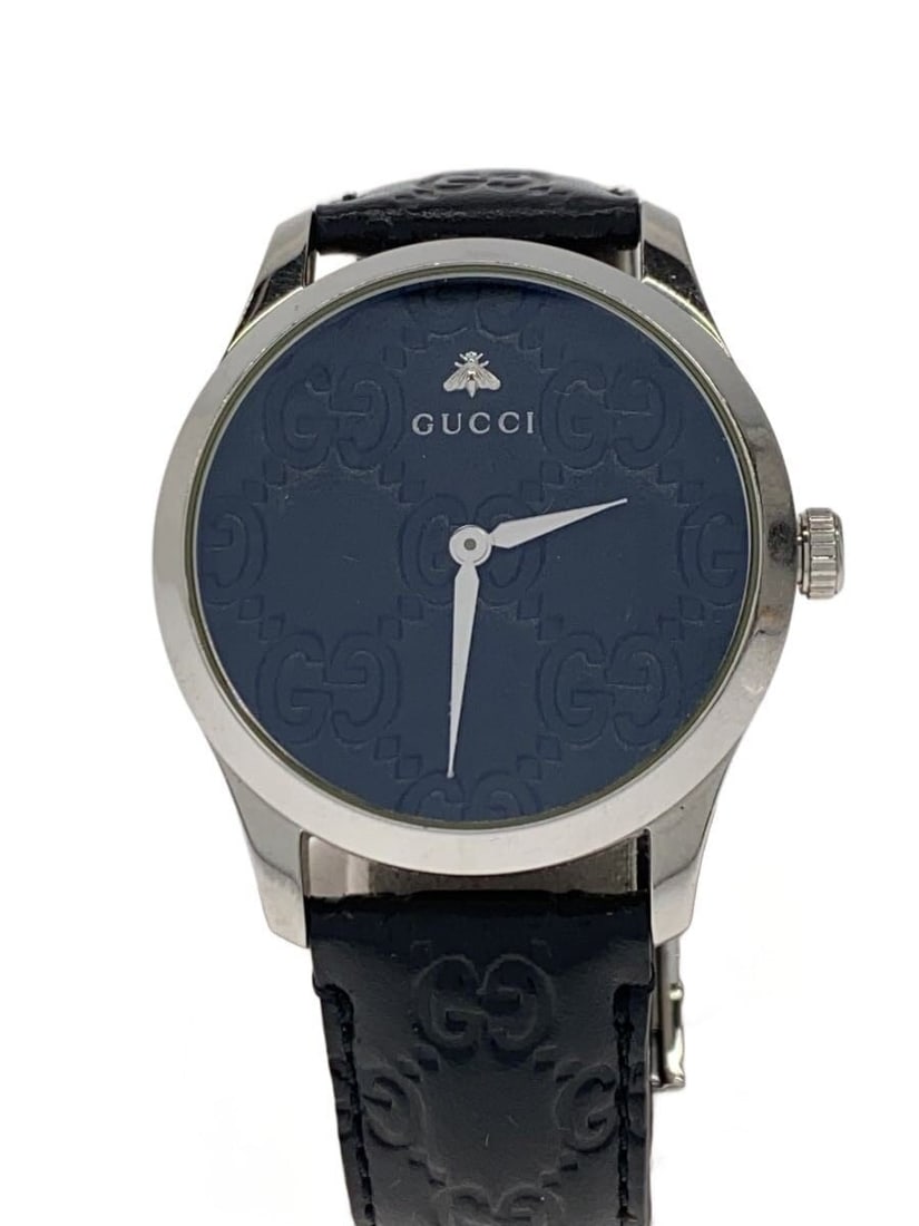 Gucci G Timeless Swiss Quartz Leather Men's Wristwatch YA1264033A: Gucci G Timeless Swiss Quartz Leather Men's Wristwatch YA1264033A This is a Gucci G-Timeless quartz men's wristwatch featuring a leather band. The watch is Swiss-made and designed for men, with a clas
