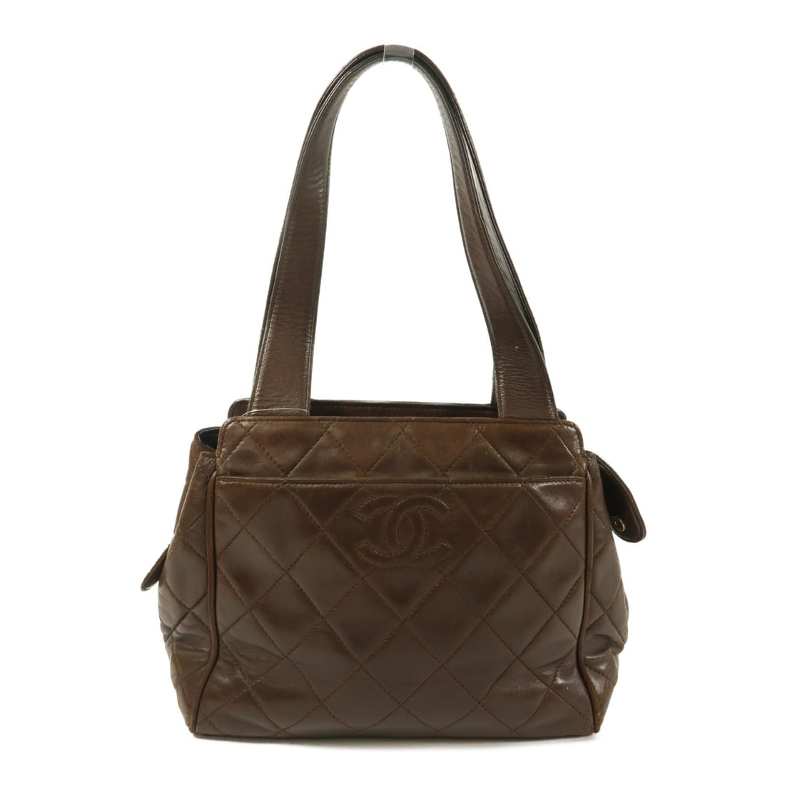 CHANEL Vintage Brown Lambskin Leather Handbag: CHANEL Vintage Brown Lambskin Leather Handbag Vintage CHANEL handbag in brown lambskin leather with the classic CC design. Made in France, this women's handbag shows reasonable wear and tear consisten