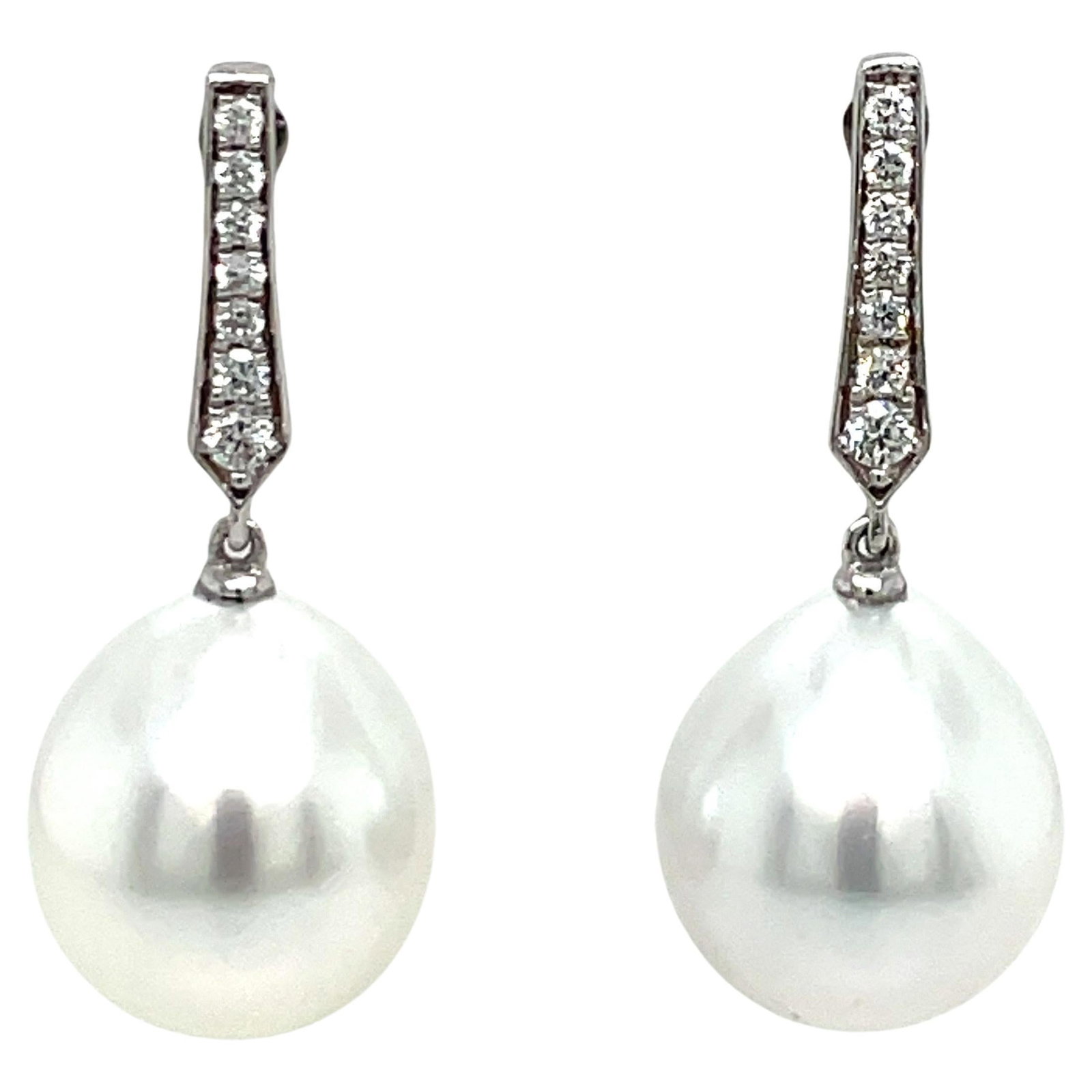 Harbor Diamonds 18K White Gold Diamond South Sea Pearl Drop Earrings: Harbor Diamonds 18K White Gold Diamond South Sea Pearl Drop Earrings Elevate your elegance with these stunning 18 Karat White Gold Diamond South Sea Drop Earrings. These contemporary earrings feature 