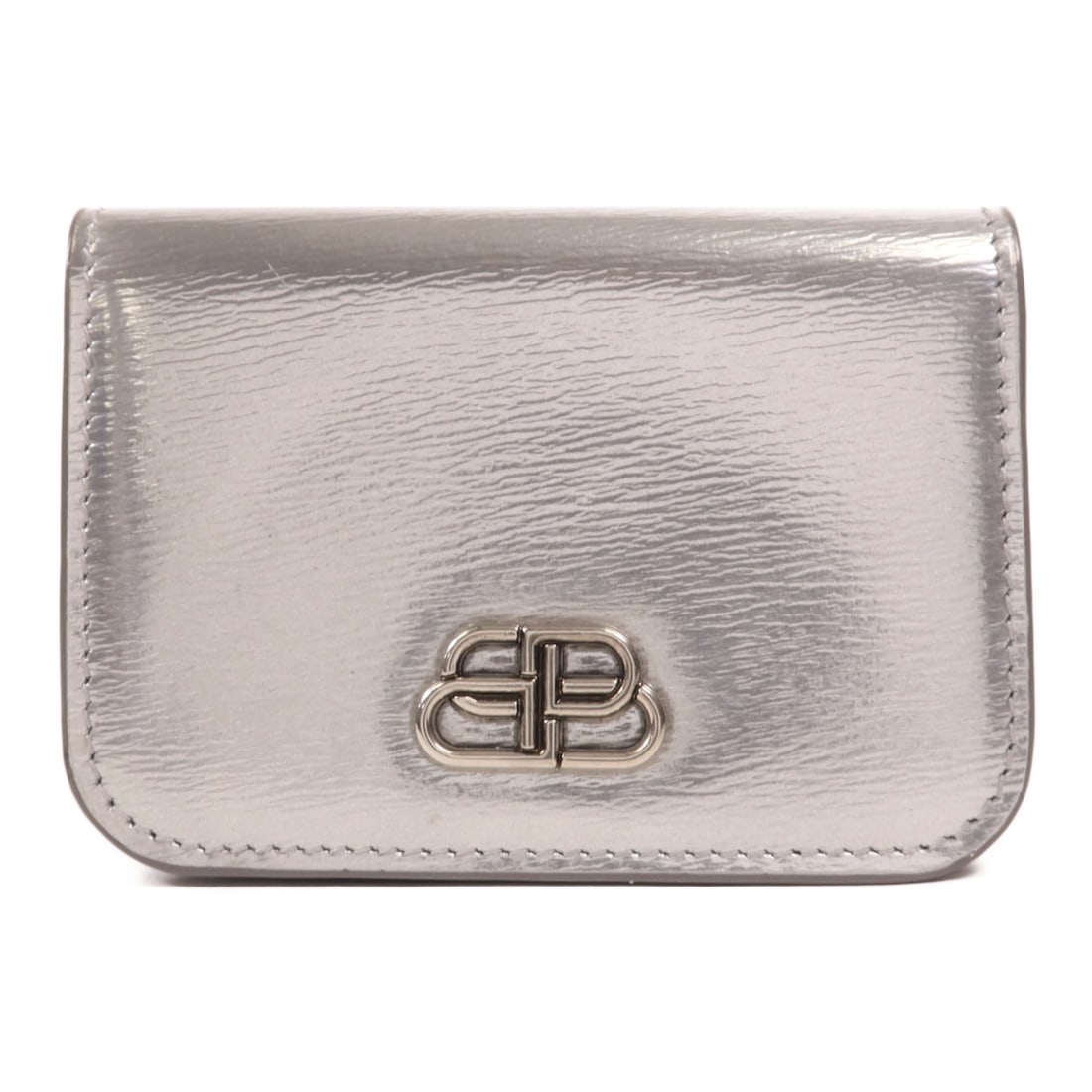 Balenciaga Silver Calfskin Tri Fold Wallet 601387: Balenciaga Silver Calfskin Tri Fold Wallet 601387 This Balenciaga tri-fold wallet is crafted from high-quality calfskin leather in a striking silver color. Designed for women, it features a sleek and 