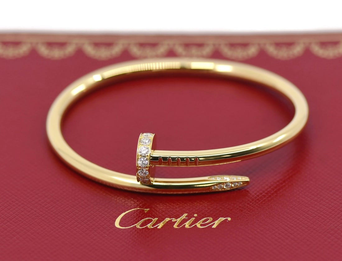 Cartier Juste un Clou Diamond Bangle 18K Yellow Gold Bracelet Size 15: Cartier Juste un Clou Diamond Bangle 18K Yellow Gold Bracelet Size 15 This Cartier Juste un Clou bangle bracelet is crafted from 18K yellow gold and features diamond accents. It is a size 15 and comes