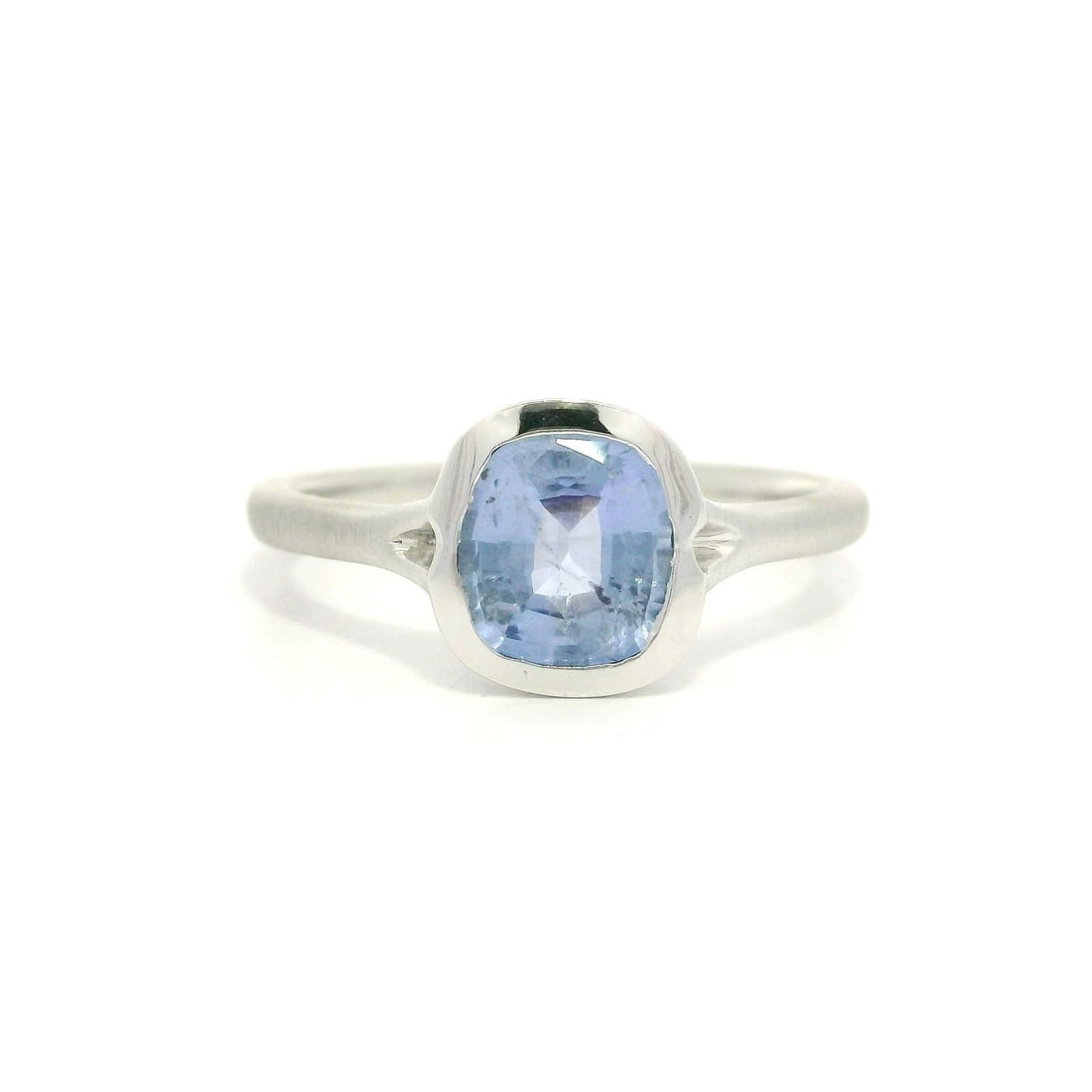 Platinum Ring With GIA Certified 1.19ct Cushion Ceylon No Heat Sapphire: Platinum Ring With GIA Certified 1.19ct Cushion Ceylon No Heat Sapphire This pre-owned platinum solitaire ring features a certified natural 1.19 carat cushion-cut Ceylon sapphire with a pastel blue co