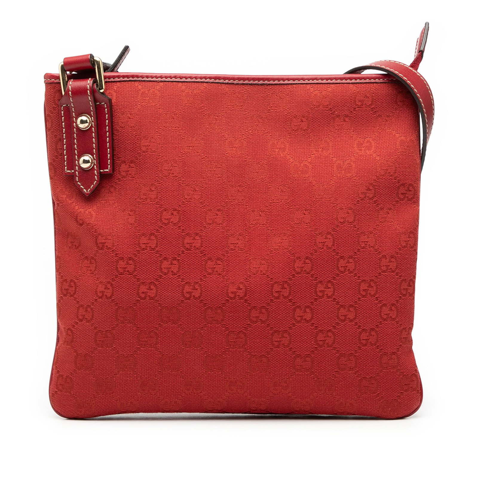 Red Gucci GG Canvas Shoulder Bag with Leather Trim and Adjustable Strap: Red Gucci GG Canvas Shoulder Bag with Leather Trim and Adjustable Strap This Gucci GG Canvas Crossbody bag features a canvas body with leather trim, an adjustable flat leather shoulder strap, a top zi