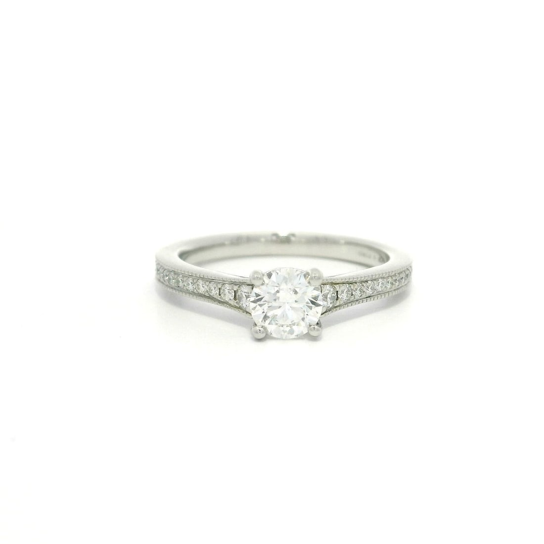 Hearts On Fire Platinum 0.67ctw Diamond Solitaire Engagement Ring: Hearts On Fire Platinum 0.67ctw Diamond Solitaire Engagement Ring This stunning Hearts On Fire Platinum Engagement Ring showcases a total carat weight of approximately 0.67ct, featuring a captivating 