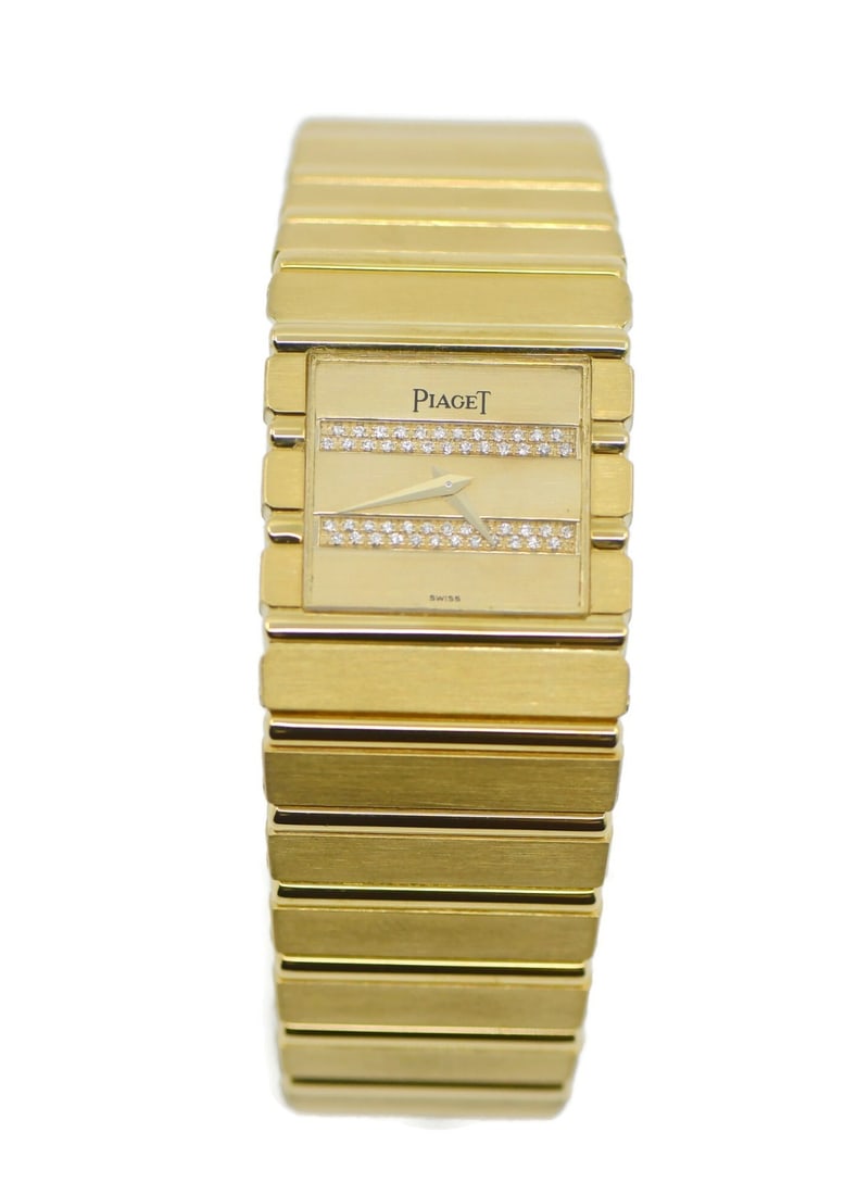 Piaget Polo 18K Yellow Gold Diamond Quartz Wristwatch: Piaget Polo 18K Yellow Gold Diamond Quartz Wristwatch This Piaget Polo wristwatch features an elegant 18K yellow gold case and bracelet, complemented by a diamond-set bezel and a gold-tone dial adorne