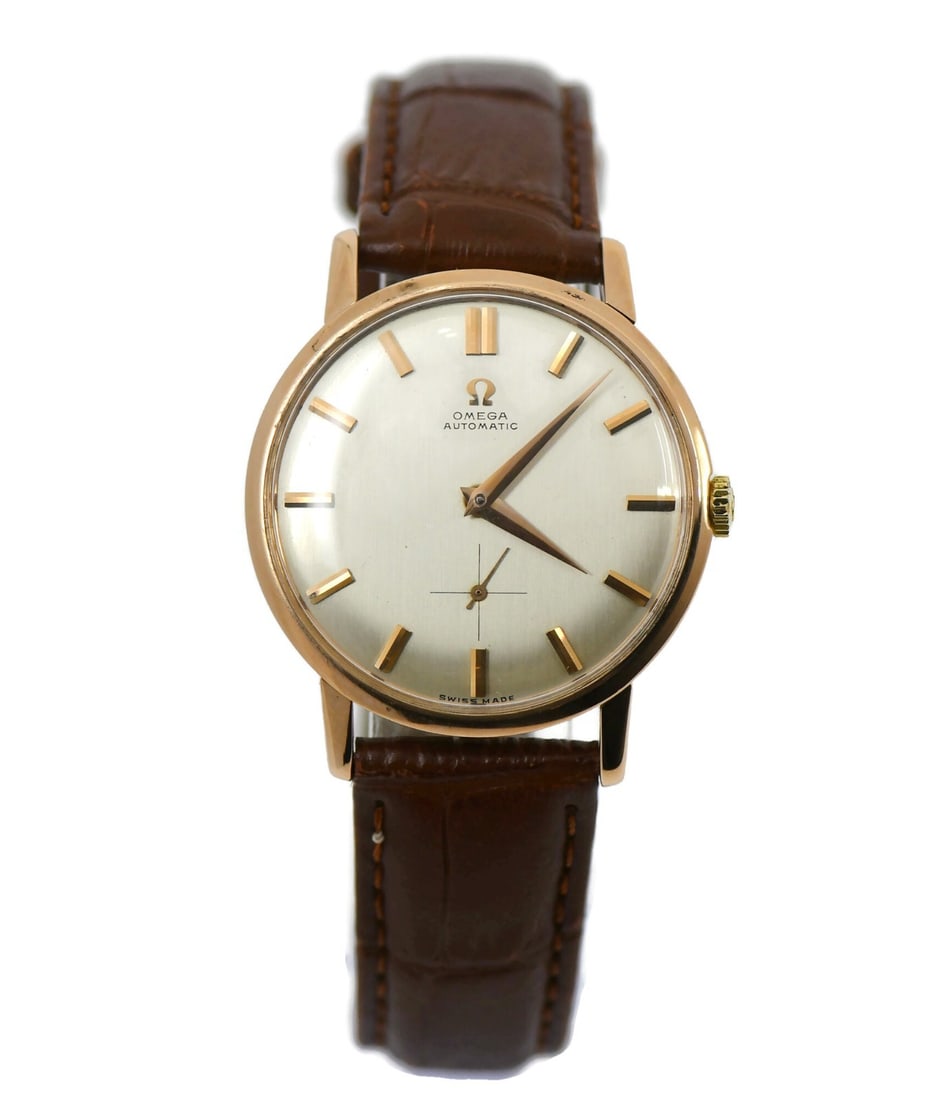 Omega 18K Rose Gold Automatic Wristwatch 2898SC: Omega 18K Rose Gold Automatic Wristwatch 2898SC This Omega vintage wristwatch features a 34mm case crafted from 18K rose gold and is equipped with a mechanical automatic movement. The watch has an ana