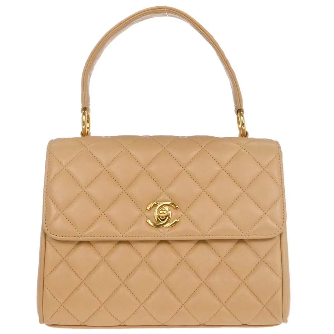 Beige Quilted Lambskin Chanel Vintage Flap Bag with Top Handle: Beige Quilted Lambskin Chanel Vintage Flap Bag with Top Handle This Chanel Vintage Top Handle Flap Bag features a classic quilted lambskin leather exterior in beige, designed for women. The bag is in 