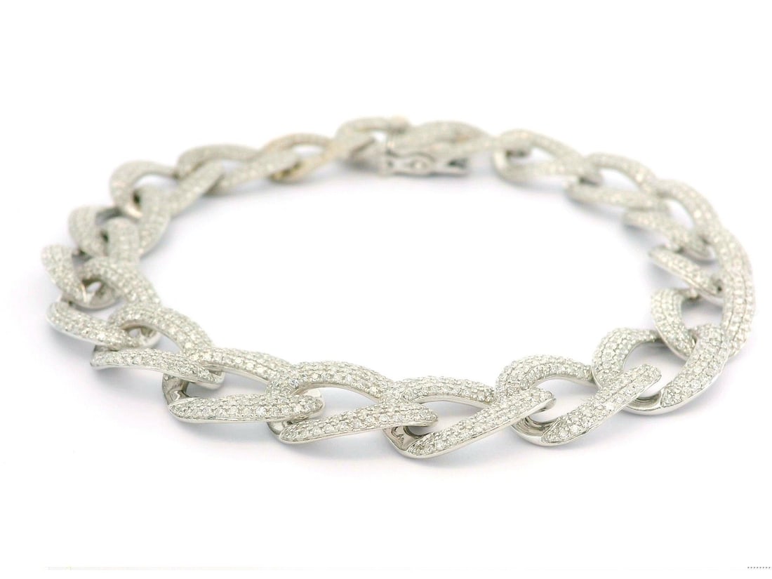 14k White Gold 3.50ctw Micro Pave Diamond Cuban Link Bracelet: 14k White Gold 3.50ctw Micro Pave Diamond Cuban Link Bracelet This stunning 14k white gold bracelet features a luxurious low profile curb Cuban link design, adorned with a total of 3.50 carats of micr