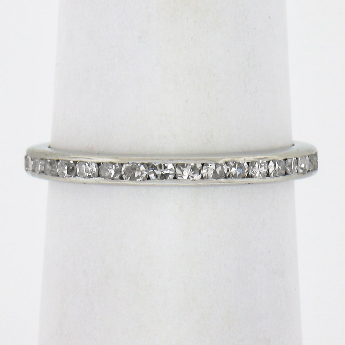 Antique Platinum 0.60ctw Channel Set Diamond Eternity Band Ring: Antique Platinum 0.60ctw Channel Set Diamond Eternity Band Ring This exquisite antique platinum eternity band ring features a stunning array of 36 natural old single cut diamonds, channel set for a ti