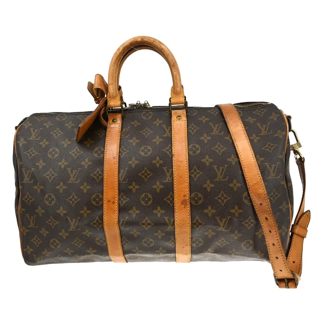 Louis Vuitton Keepall Bandouliere travel bag in monogram canvas: Louis Vuitton Keepall Bandouliere travel bag in monogram canvas Louis Vuitton Keepall Bandouliere in brown monogram canvas. This unisex bag is in fair condition with visible wear, including scuffs, sc