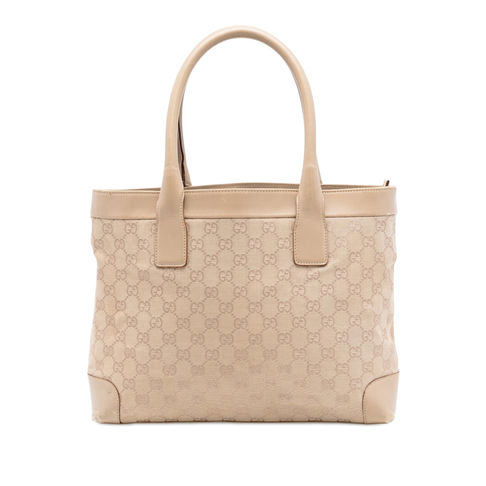 Gucci beige canvas tote with leather trim: Gucci beige canvas tote with leather trim This Gucci GG Canvas Tote is crafted in Italy and features a beige canvas body with leather trim and rolled leather handles. The bag is designed with a top zi
