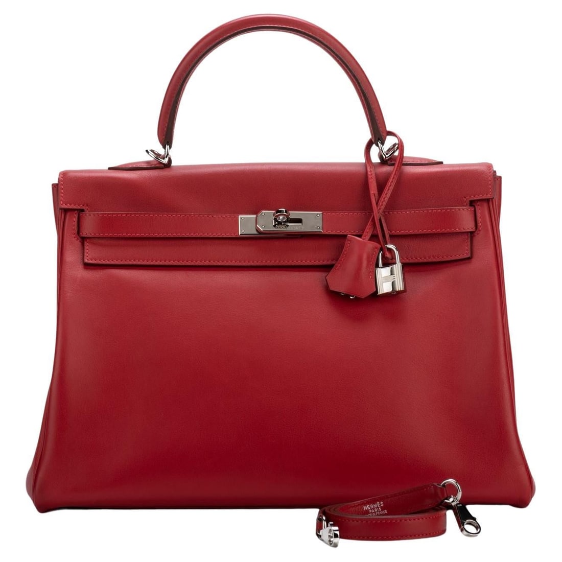Hermes Kelly 35 Rouge Casaque Swift Leather with Palladium Hardware: Hermes Kelly 35 Rouge Casaque Swift Leather with Palladium Hardware Discover the elegance of the Hermes Kelly 35 in the striking Rouge Casaque color. This iconic handbag features soft Swift leather co