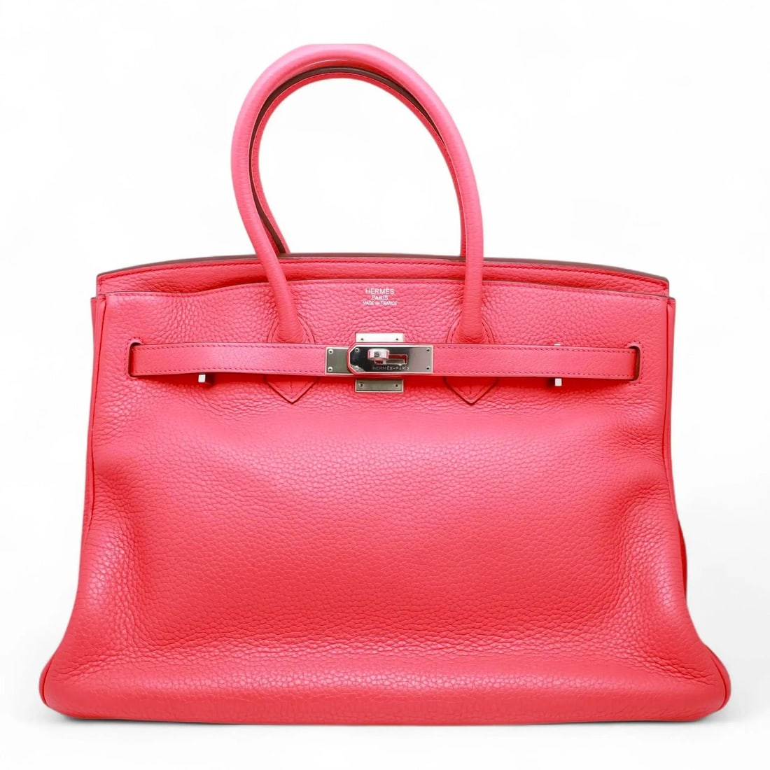 Hermes Birkin 35 Clemence Leather Tote in Red Rouge Casaque with Palladium Hardware: Hermes Birkin 35 Clemence Leather Tote in Red Rouge Casaque with Palladium Hardware Introducing the Hermes Birkin 35, a luxurious handbag crafted in Italy. This iconic tote features a striking Red Rou