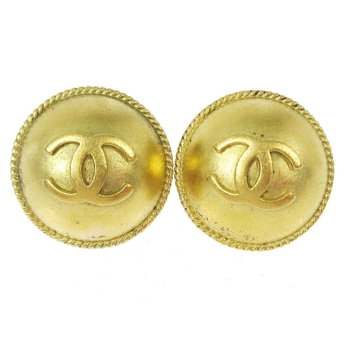 Chanel 94A Gold Tone CC Logo Button Clip Earrings: Chanel 94A Gold Tone CC Logo Button Clip Earrings Clip-on Chanel button earrings featuring the CC logo motif in a gold-tone finish. Made in France, these earrings are marked 94A and present a classic 