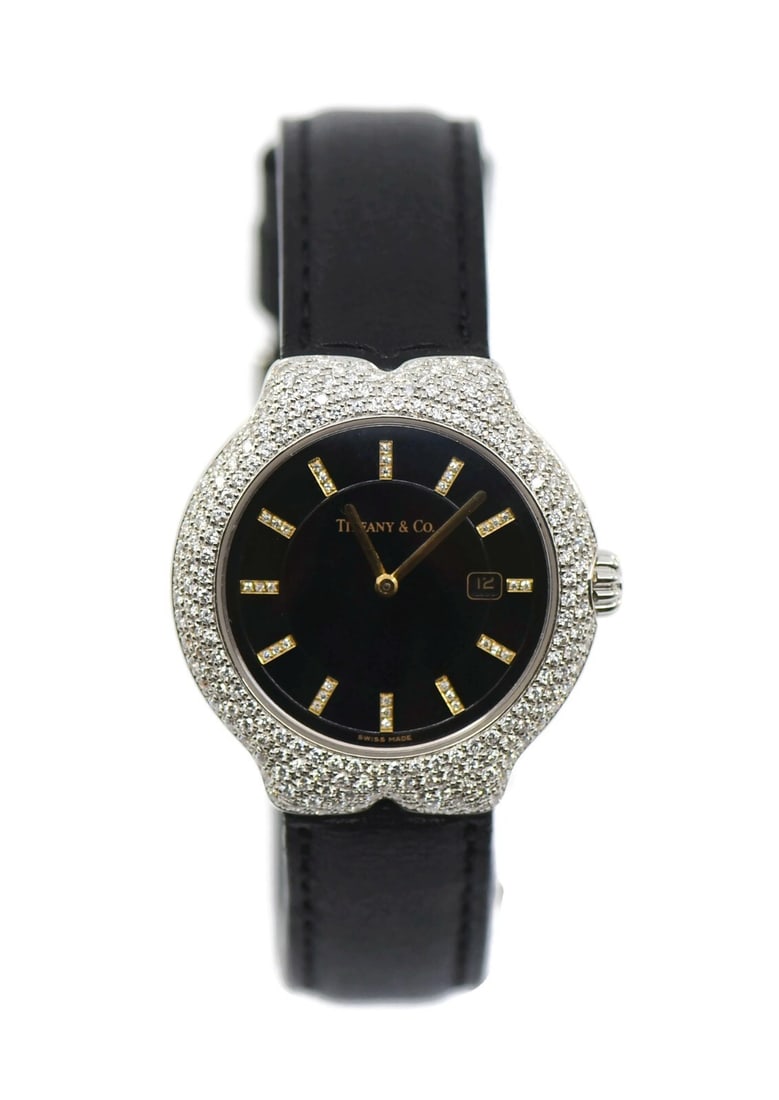 Tiffany & Co Tesoro Diamond 18K White Gold Watch 33mm M0130: Tiffany & Co Tesoro Diamond 18K White Gold Watch 33mm M0130 This exquisite Tiffany & Co. Tesoro Diamond Wristwatch combines elegance and luxury. Crafted from 18K white gold, it features a stunning dia