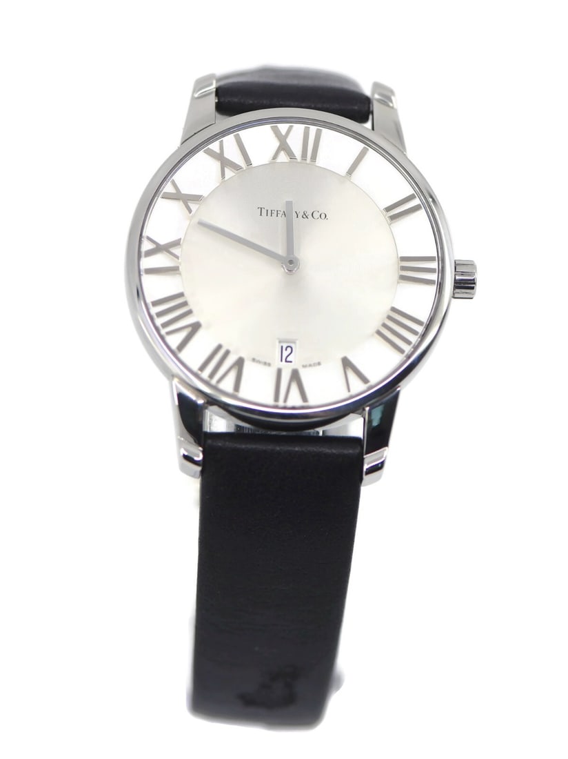 Tiffany & Co Atlas Quartz Stainless Steel Watch Black Leather Band: Tiffany & Co Atlas Quartz Stainless Steel Watch Black Leather Band Experience the elegance of the Tiffany & Co. Atlas Stainless Steel Watch, a timeless wristwatch that combines sophisticated design wi