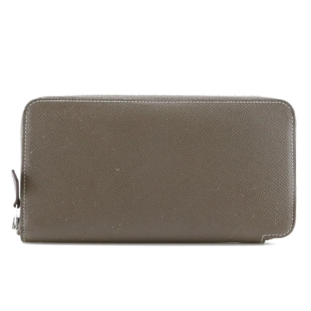 Hermes Azap Zip Around Beige Leather Wallet: Hermes Azap Zip Around Beige Leather Wallet This Hermes Azap Zip Around Wallet for women features a beige Epsom leather exterior with minor scratches, corner thread wear, and light fluffing. The inter