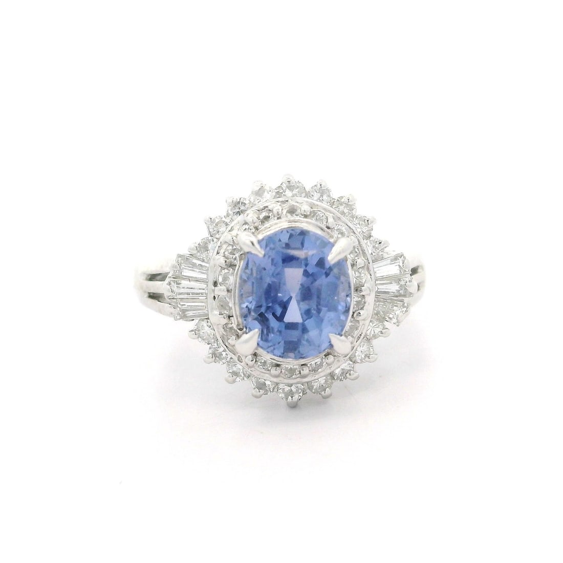 Platinum GIA Certified 2.56ctw No Heat Periwinkle Blue Sapphire Diamond Ring: Platinum GIA Certified 2.56ctw No Heat Periwinkle Blue Sapphire Diamond Ring This exquisite ballerina ring showcases a stunning natural periwinkle blue sapphire, weighing 2.0 carats, which is certifie