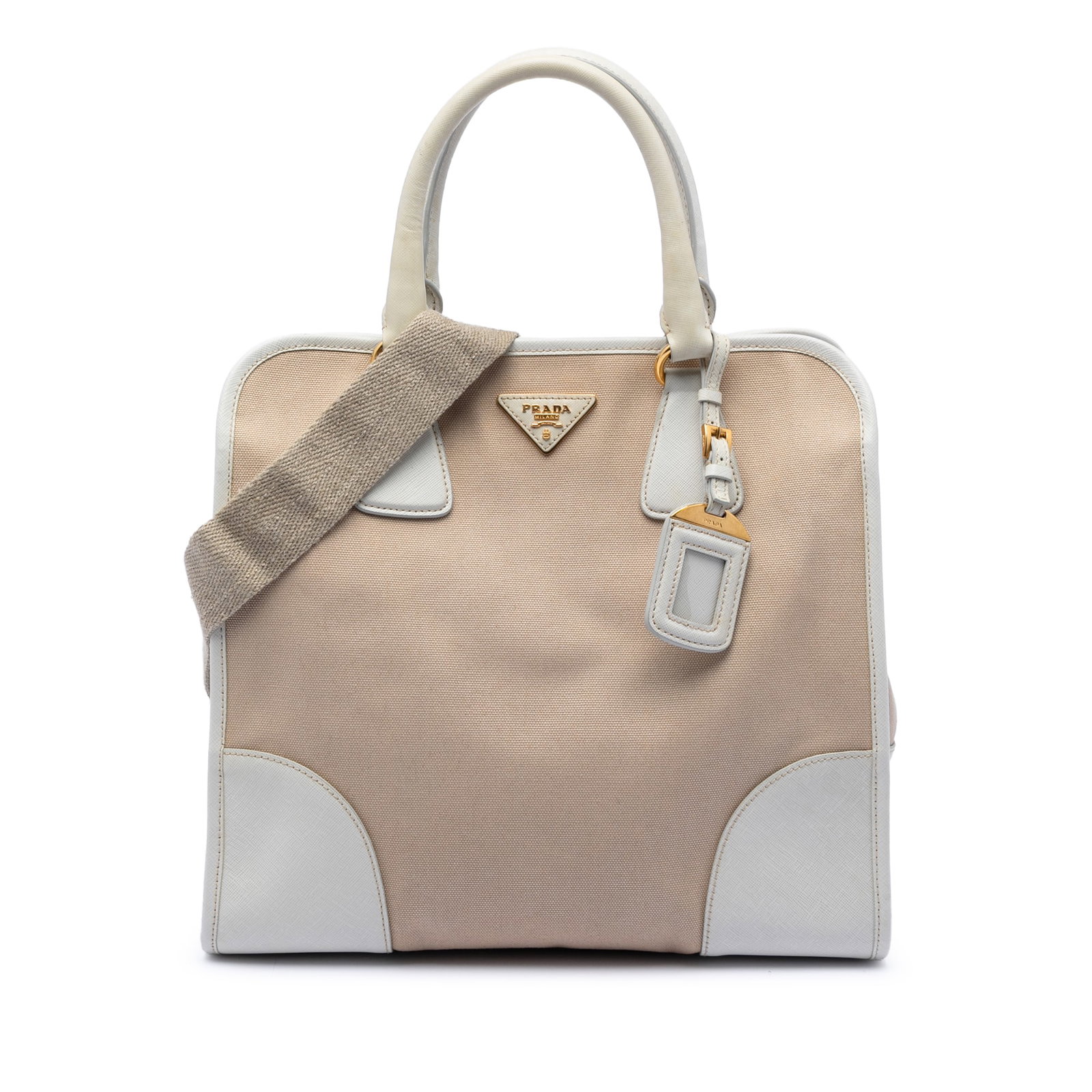 Prada Canapa Satchel in Canvas with Saffiano Leather Accents: Prada Canapa Satchel in Canvas with Saffiano Leather Accents This Prada Saffiano Trimmed Canvas Canapa Satchel features a beige canvas body with saffiano leather trim, rolled leather handles, and a de