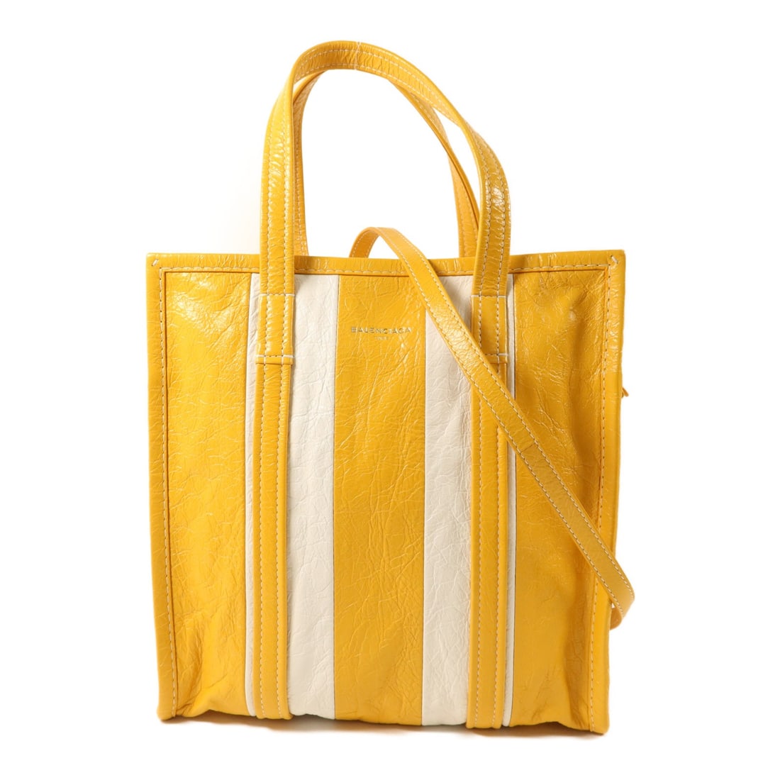 Balenciaga Bazar Yellow Calfskin 2 Way Shoulder Tote with Silver Hardware: Balenciaga Bazar Yellow Calfskin 2 Way Shoulder Tote with Silver Hardware This Balenciaga Bazar Shopper 2 Way Shoulder Bag features a versatile design crafted from calfskin leather in white. The bag o